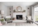 Close up of living room fireplace, chairs, and decor at 203 Leerkamp Dr, Franklin, IN 46131