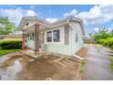 Welcoming single-story house with cozy porch and a driveway on a sunny day at 2726 Apache Dr, Anderson, IN 46012