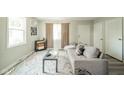 Cozy living room features neutral tones, area rug, and lots of natural light at 2726 Apache Dr, Anderson, IN 46012