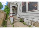 A classic home featuring a covered side entry and concrete steps at 3134 N College Ave, Indianapolis, IN 46205