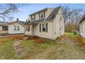 Charming two-story home with siding, green shutters, and small porch at 3305 N Arlington Ave, Indianapolis, IN 46218