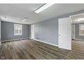 Spacious living room with grey walls and modern wood-look flooring at 3305 N Arlington Ave, Indianapolis, IN 46218