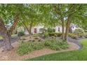Picturesque home exterior showcasing lovely landscaping with mature trees and tasteful plantings at 3655 Copperleaf Blvd, Greenwood, IN 46143