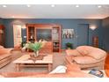 Cozy living room featuring comfortable seating, built-in entertainment center, and stylish decor at 5135 Moller Rd, Indianapolis, IN 46254