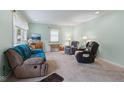 Inviting living room with cozy seating, a TV, and natural light at 5326 Brazos Dr, Indianapolis, IN 46237