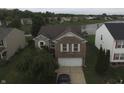 Aerial shot of home near pond showcasing backyard space and neighborhood at 5502 Floating Leaf Dr, Indianapolis, IN 46237