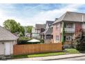 Street view showing a charming house with a fenced backyard at 635 E 10Th St, Indianapolis, IN 46202