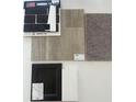 Selection of interior finish materials, including floor and wall samples for the home at 8715 Hollander Dr, Camby, IN 46113