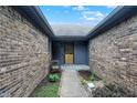 Charming front entrance with brick walls and a walkway leading to the front door at 926 Brookside Ln, Plainfield, IN 46168