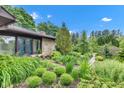 Lovely home with stone accents, lush landscaping, and inviting curb appeal at 10444 N State Road 9, Fountaintown, IN 46130