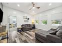 Bright living room featuring modern flooring, neutral paint, and ample natural light, creating a welcoming atmosphere at 117 N Market St, Thorntown, IN 46071
