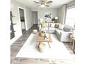 Bright living room featuring a large sectional sofa, stylish decor, and plenty of natural light at 1801 Bauer Rd, Indianapolis, IN 46218