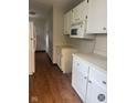 Functional kitchen featuring white cabinets and microwave at 1844 N Riley Ave, Indianapolis, IN 46218