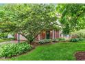 Well-maintained home with a green lawn and mature tree shading the front yard at 19061 Fairfield Blvd, Noblesville, IN 46060