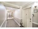 Condo hallway view showing clean well-lit neutral colored hallways at 20971 Shoreline Ct # 201, Noblesville, IN 46062