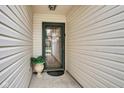 Cozy covered front porch with decorative glass door and charming decor at 2163 Bradford Trace Blvd, Indianapolis, IN 46229