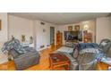 Cozy living room features hardwood floors, comfortable seating, and ample natural light at 2445 S Bolton Ave, Indianapolis, IN 46203