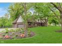 Beautiful exterior view showcasing a manicured lawn, tasteful landscaping, and three-car garage at 246 Westchester Blvd, Noblesville, IN 46062
