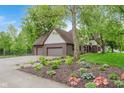 Beautiful home with a manicured lawn, landscaping, and a three-car garage at 246 Westchester Blvd, Noblesville, IN 46062