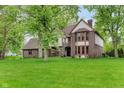 Charming two-story home showcasing a well-manicured lawn and mature trees at 246 Westchester Blvd, Noblesville, IN 46062
