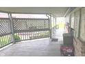 Relaxing back porch offering ample space for outdoor enjoyment and scenic views at 3107 N 100 W, Shelbyville, IN 46176