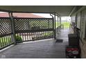 View of covered porch with detailed latticework at 3107 N 100 W, Shelbyville, IN 46176