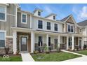 Charming townhome showcases stone accents and a well-maintained front yard at 3947 Wren Dr, Brownsburg, IN 46112
