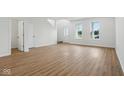 Bright living room featuring hardwood floors and abundant natural light at 3947 Wren Dr, Brownsburg, IN 46112