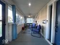 Cozy screened-in porch featuring comfortable seating and stylish decor at 4040 Carrollton Ave, Indianapolis, IN 46205