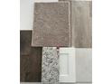 This shows flooring, carpet, countertop and cabinetry samples for your design selections at 438 Weaver Ln, Pittsboro, IN 46167