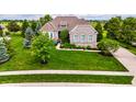 Beautiful single-Gathering home featuring a well-manicured lawn and lush landscaping at 4420 Hickory Ridge Blvd, Greenwood, IN 46143