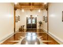 Beautiful lobby with polished floors, wood beams and stylish décor for a welcoming entrance at 55 S Harding St # 308, Indianapolis, IN 46222