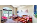 Bright, carpeted bedroom with large window and two twin beds at 6110 Pelican Ln, Columbus, IN 47201