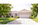 Lovely single-story home featuring a well-manicured lawn and wide driveway at 6110 Pelican Ln, Columbus, IN 47201