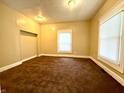 Cozy bedroom featuring two windows and a spacious closet at 745 N Tremont St, Indianapolis, IN 46222