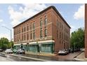 Classic red brick building featuring traditional architecture and inviting commercial and residential spaces at 970 Fort Wayne Ave # 303, Indianapolis, IN 46202