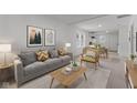 Inviting living space features stylish decor and an open layout to dining area at 1606 Asbury St, Indianapolis, IN 46203