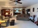 Spacious living room with two sofas, connecting to the dining area and kitchen, perfect for entertaining guests at 1711 Lafayette Ave # 7, Lebanon, IN 46052