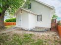 Bright home exterior boasts new siding and manicured surroundings at 2528 S Pennsylvania St, Indianapolis, IN 46225