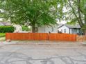 Charming home with a well maintained orange fence at 2528 S Pennsylvania St, Indianapolis, IN 46225