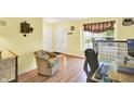 Inviting living room featuring hardwood floors and bright, neutral paint at 2623 Senators Way, Indianapolis, IN 46217