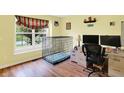 Bright room with hardwood floors and lots of natural light from a large window at 2623 Senators Way, Indianapolis, IN 46217