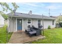 Outdoor living space with a cozy patio setup, perfect for entertaining and relaxation at 305 W Vinyard St, Anderson, IN 46011