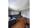 Inviting living room features hardwood floors, neutral gray walls, and a comfortable gray sectional at 3752 N Oxford St, Indianapolis, IN 46218