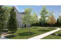 Community green space showcasing walking path, trees, and lawn areas with bench seating at 412 Elite St # 2-601, Westfield, IN 46074