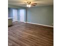 Open-concept living area with wood floors, connecting to a kitchen with a center island at 6117 Marilyn Rd, Indianapolis, IN 46226