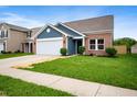 Lovely single-story home featuring brick accents, a two-car garage, and well-maintained landscaping at 7918 Wolfgang Pl, Indianapolis, IN 46239