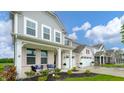 Charming two-story home with a covered porch and well-maintained landscaping at 9369 Casey Rd, Pendleton, IN 46064