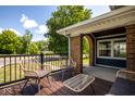 Relaxing porch seating area with modern wicker furniture, perfect for enjoying outdoor views at 949 E Southern Ave, Indianapolis, IN 46203