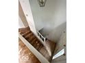 Hall with stairs, tile, and light blue walls at 9560 Bay Vista E Dr, Indianapolis, IN 46250